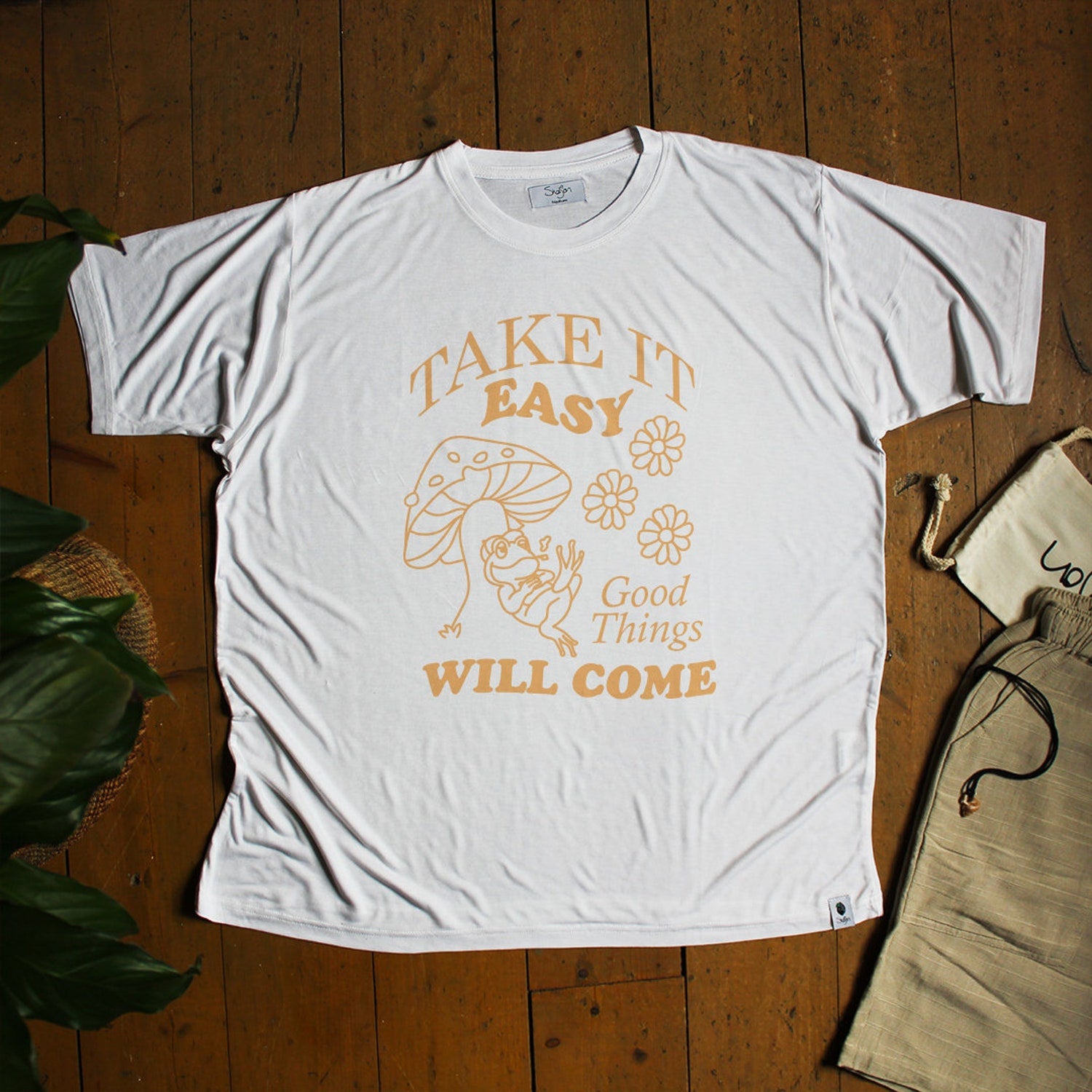 Take it Easy Chilled Frog laying on Mushroom Quote T-shirt: Eco-friendly Bamboo Tee